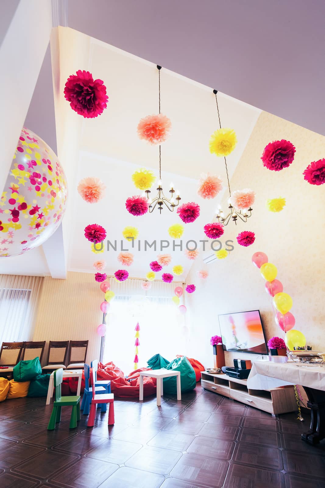 A large room with high ceilings decorated with large balloons an by Opikanets