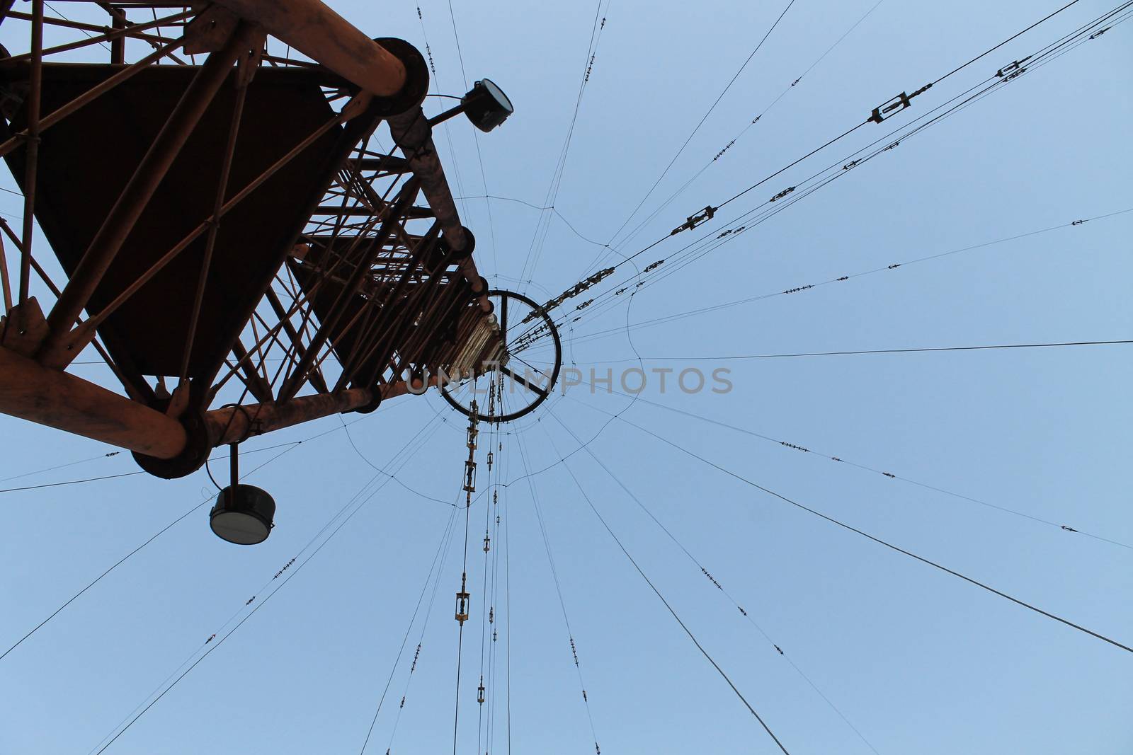 Photo of a television and radio tower from below against a blue  by Opikanets