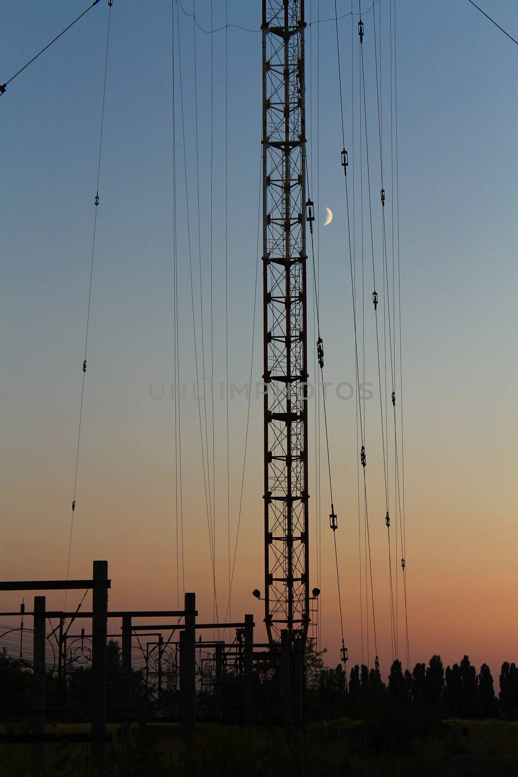 Radio and television tower on the background of the sunset and t by Opikanets