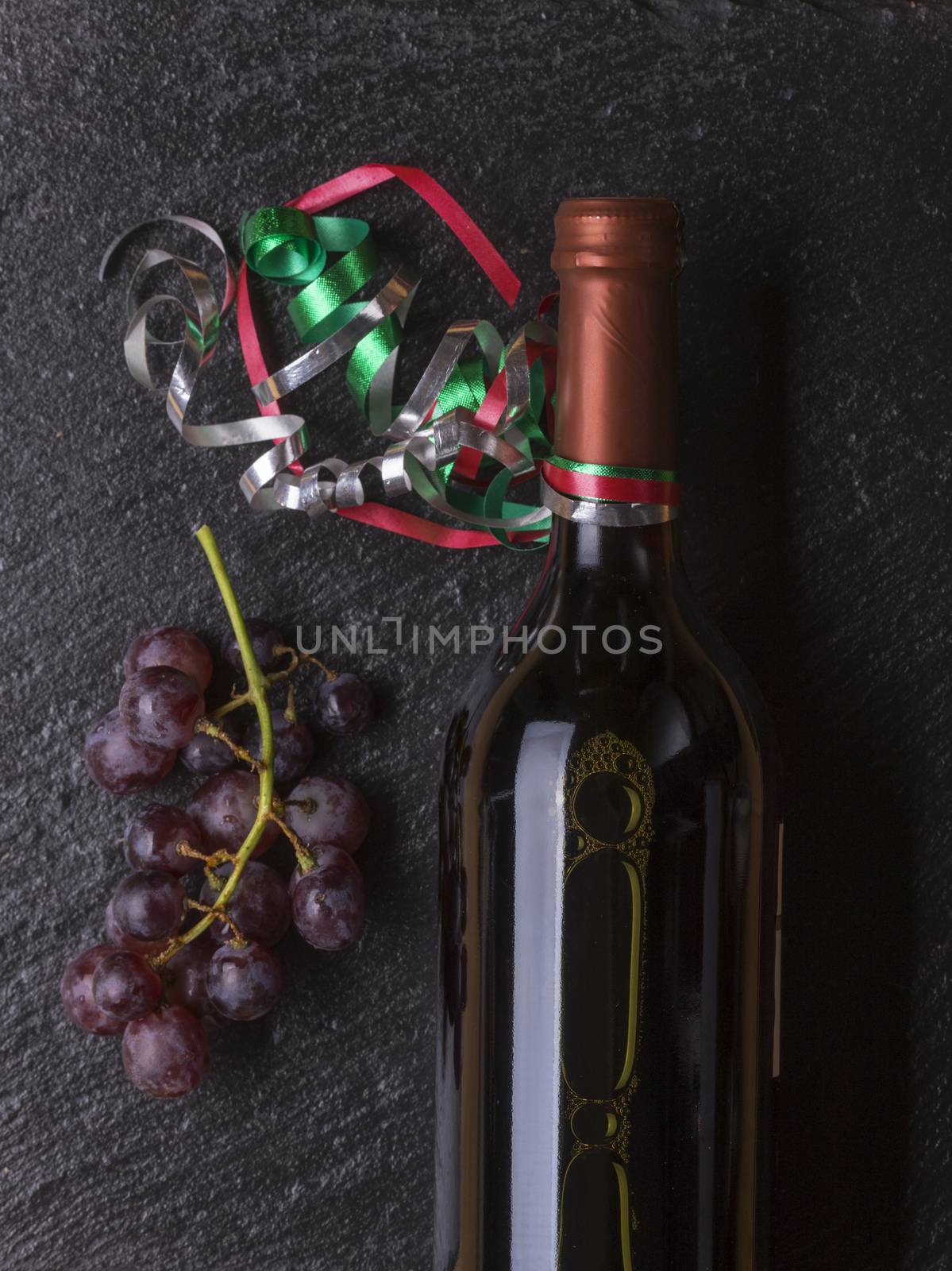 bottle of wine with grapes