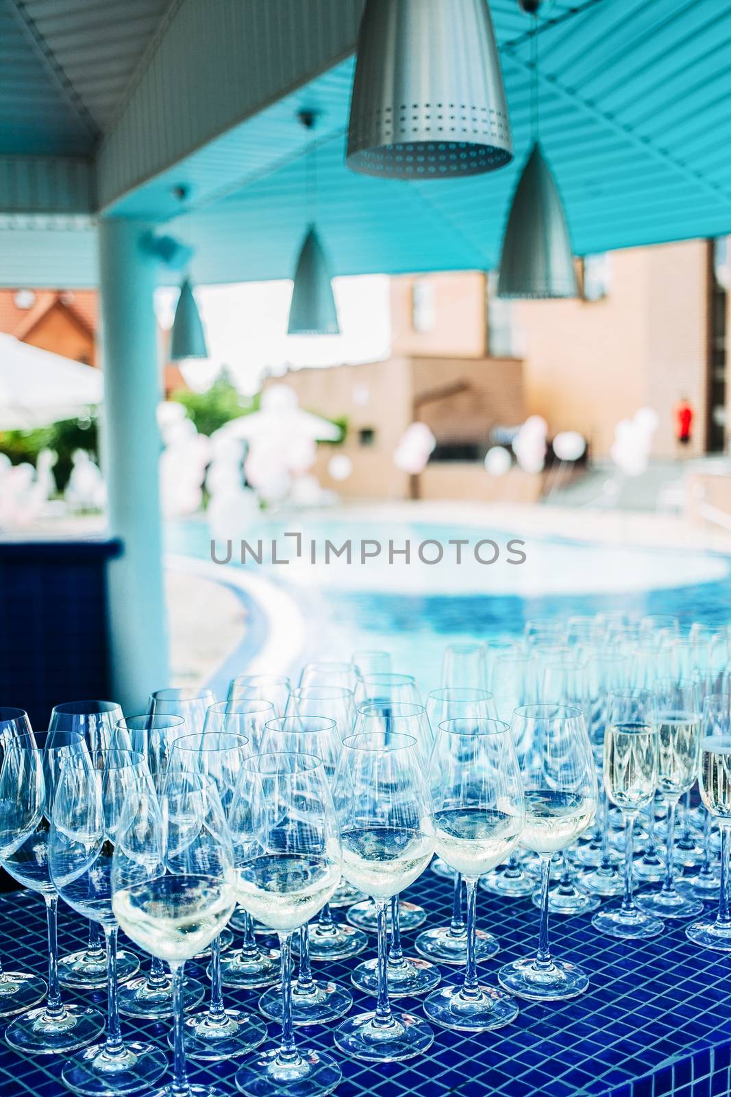 Glasses on the bar at the beach party. Glasses with champagne