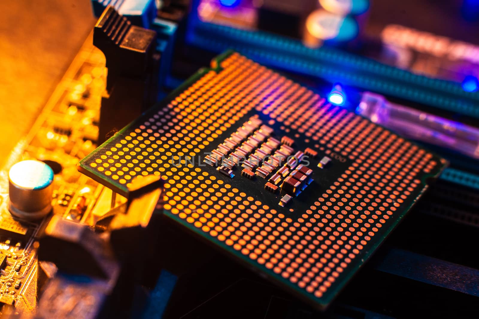 Processor with neon light. Large photo with blue-yellow light on by Opikanets