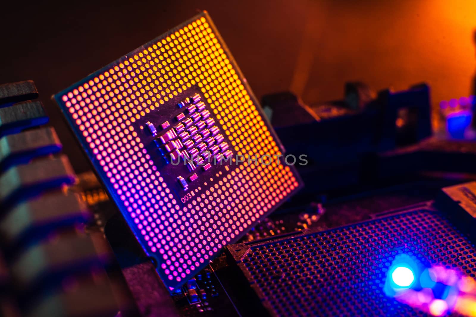 Processor with neon light. Large photo with blue-yellow light on by Opikanets