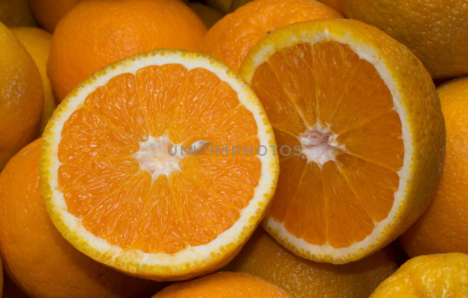Two orange halves on a market stall