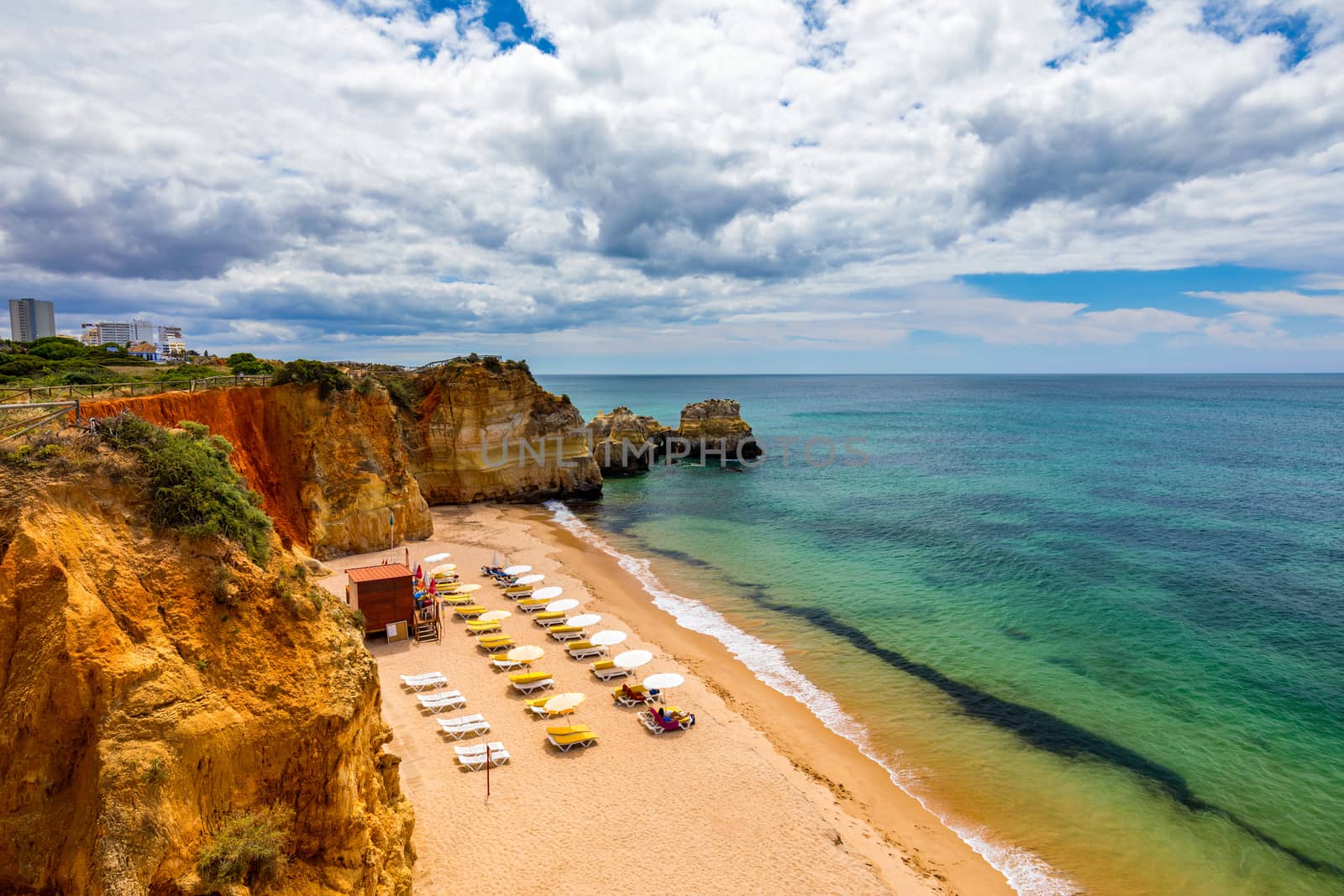 Careanos Beach (Praia dos Careanos) in Portimao, Algarve, Portugal. Concept for travel in Portugal and summer vacations in Portimao, Algarve, Portugal. 