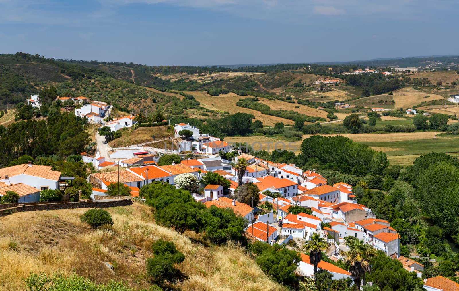 Charming architecture of hilly Aljezur, Algarve, Portugal. View to the small town of Aljezur with traditional portuguese houses and rural landscape, Algarve, Portugal.