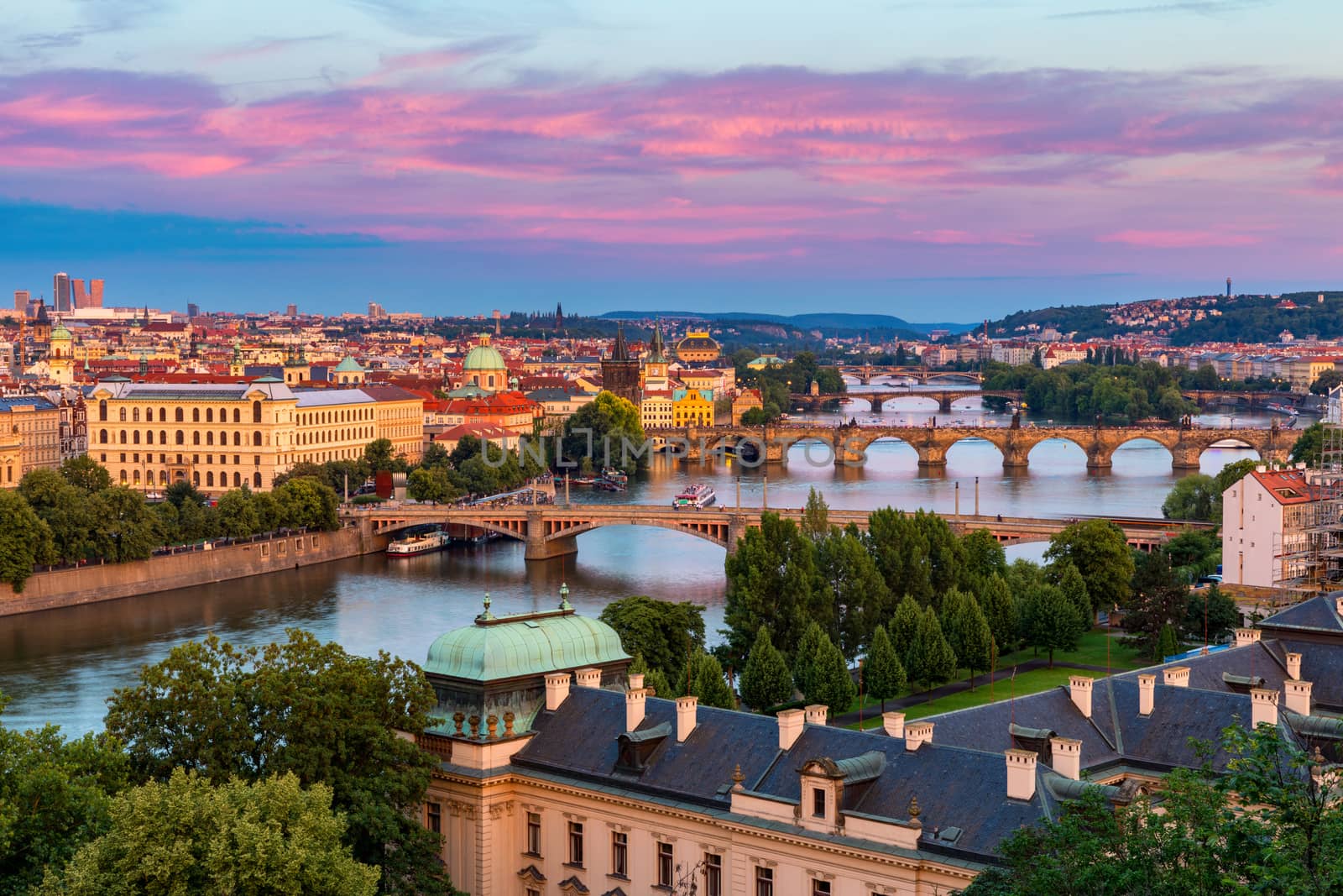 Scenic view of the Old Town pier architecture and Charles Bridge over Vltava river in Prague, Czech Republic. Prague iconic Charles Bridge (Karluv Most) and Old Town Bridge Tower at sunset, Czechia.