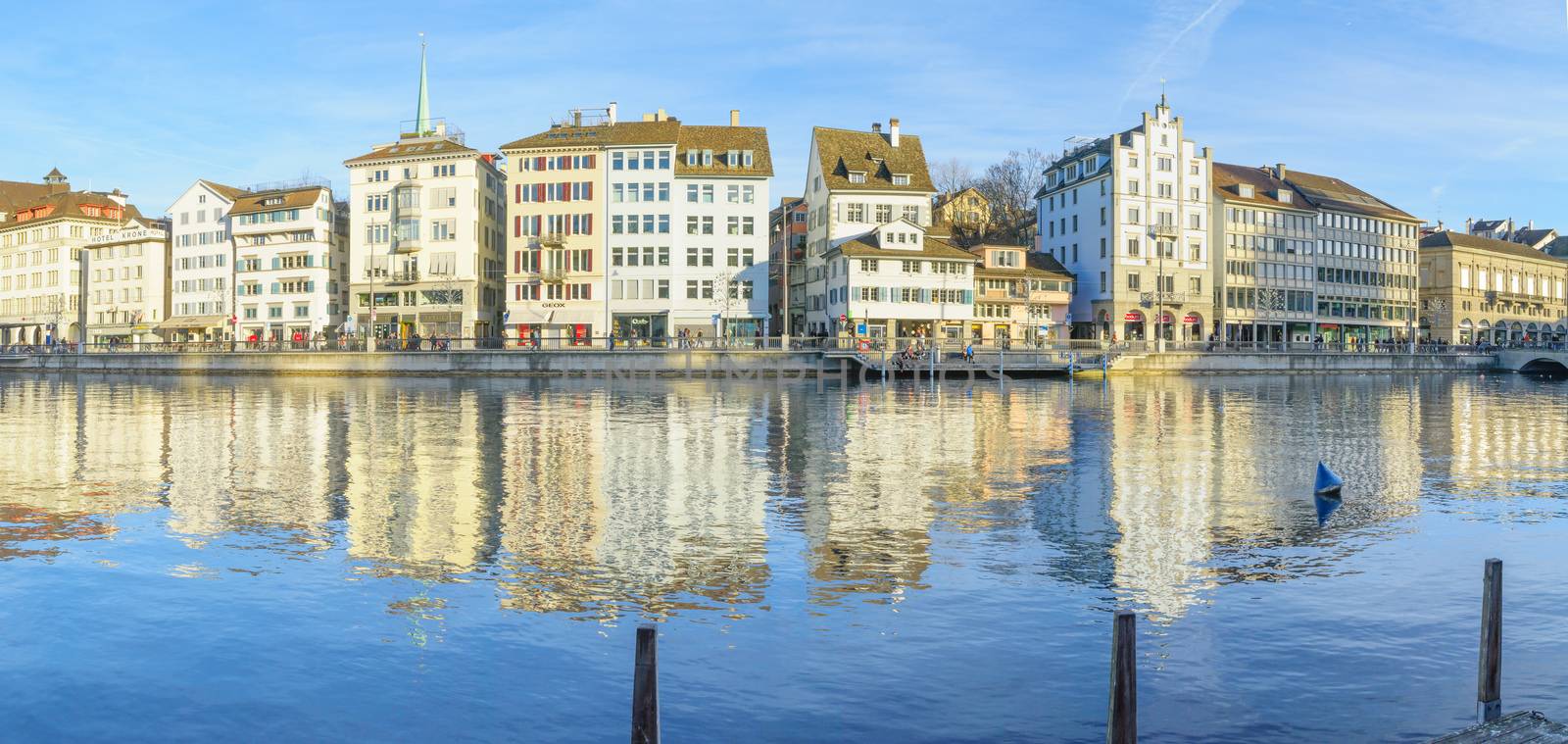 ZURICH, SWITZERLAND - DECEMBER 25, 2015: View of the Old Town (Altstadt), on the east bank of the Limmat River, with local businesses, locals and visitors. In Zurich, Switzerland