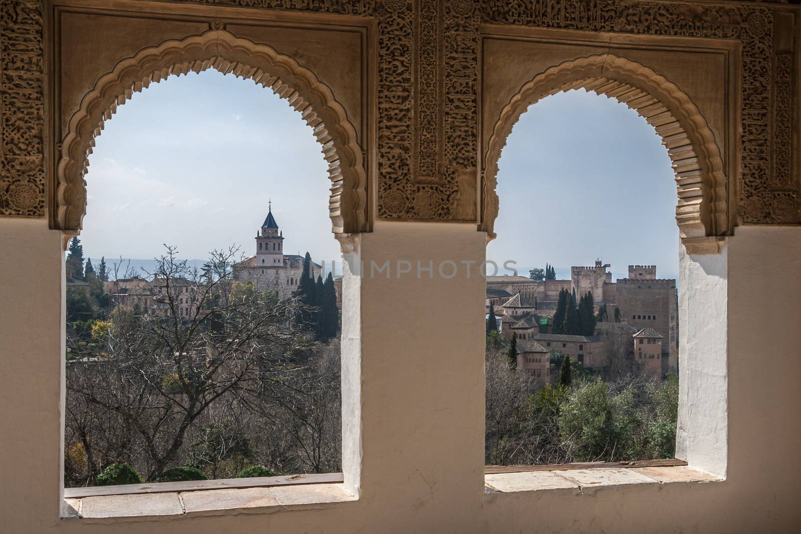 Nice windows and a view of the ancient Arabian palace Alhambra. Granada, Spain by tanaonte