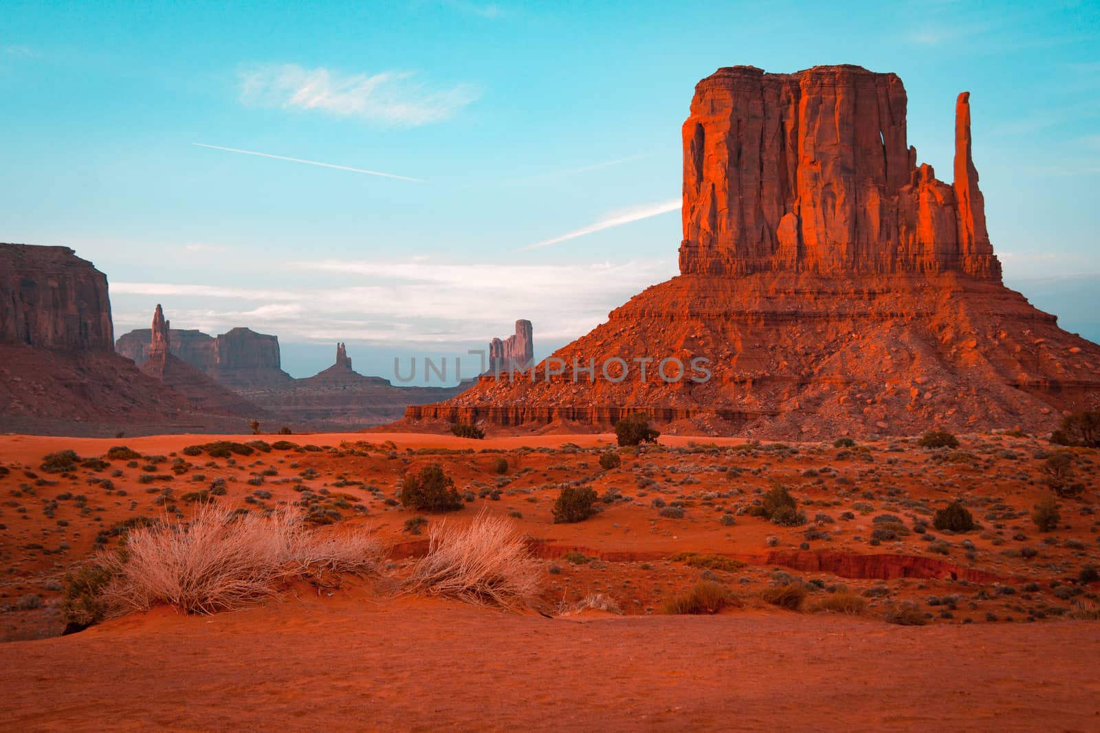 Orange and teal sunset view at Monument Valley, Arizona, USA by tanaonte