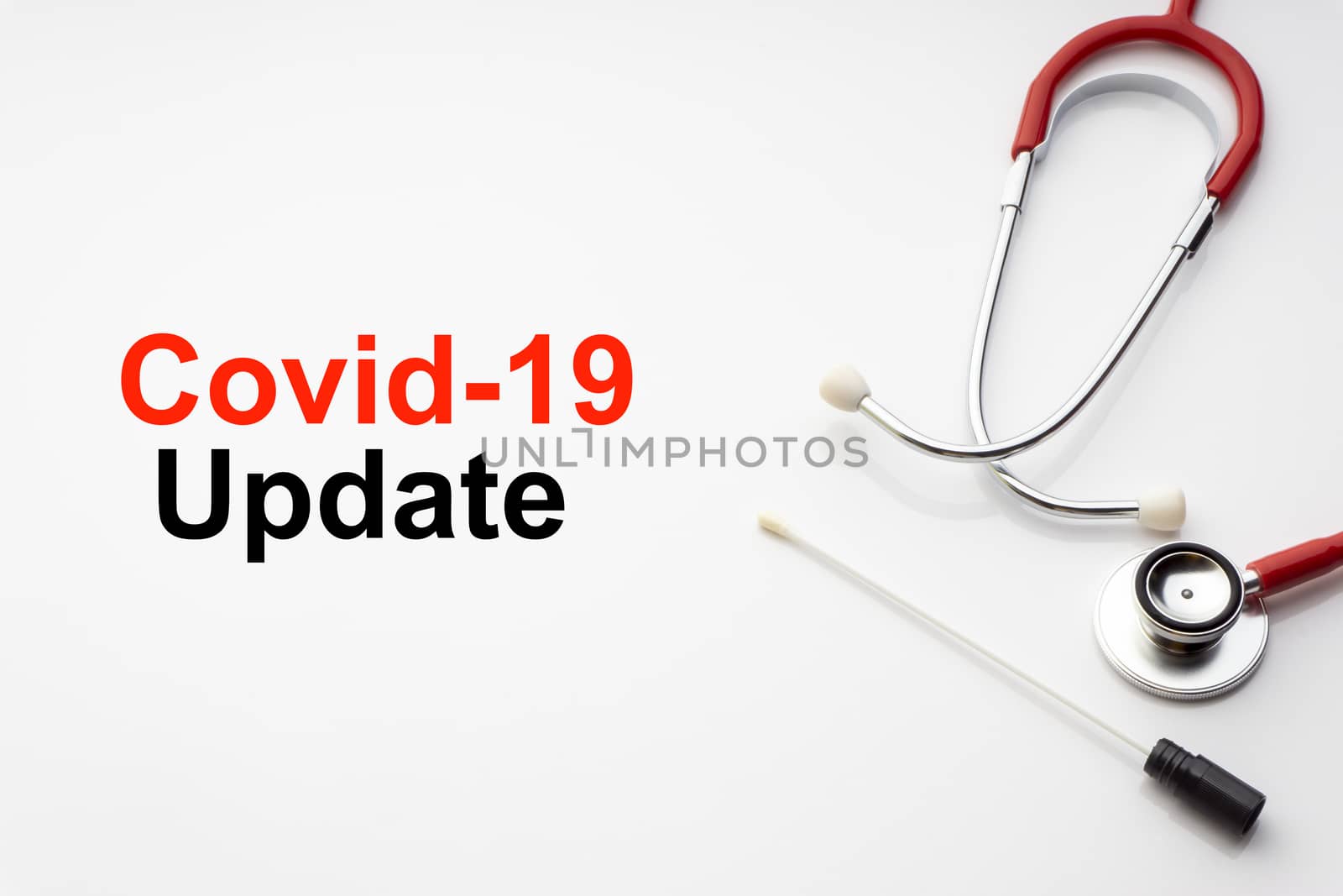 COVID-19 UPDATE text with stethoscope and medical swab on white background by silverwings