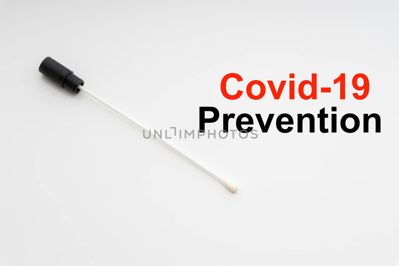 COVID-19 PREVENTION text with medical swab on white background by silverwings