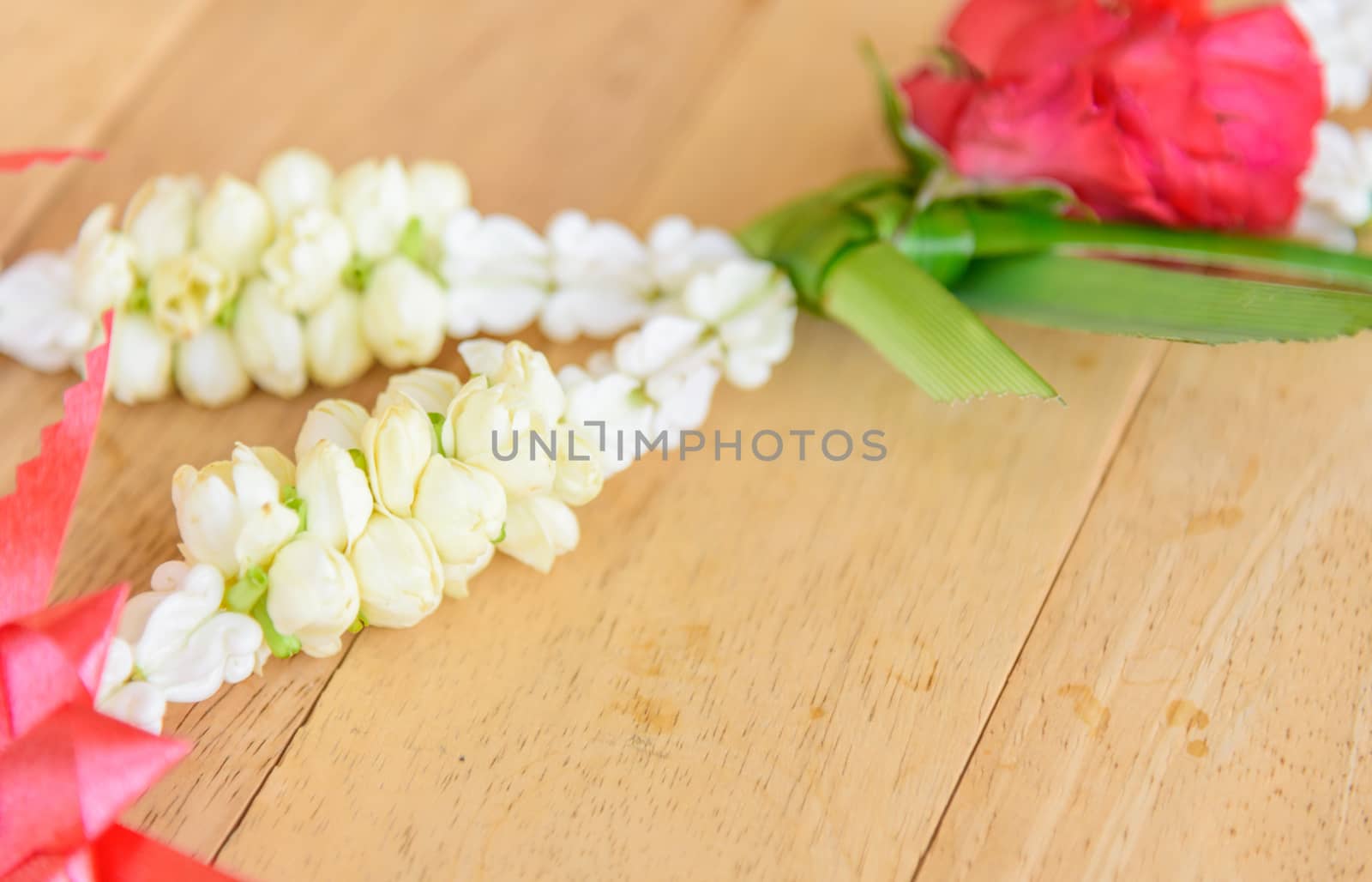 Garland to pay respect of Thai culture on wood plate