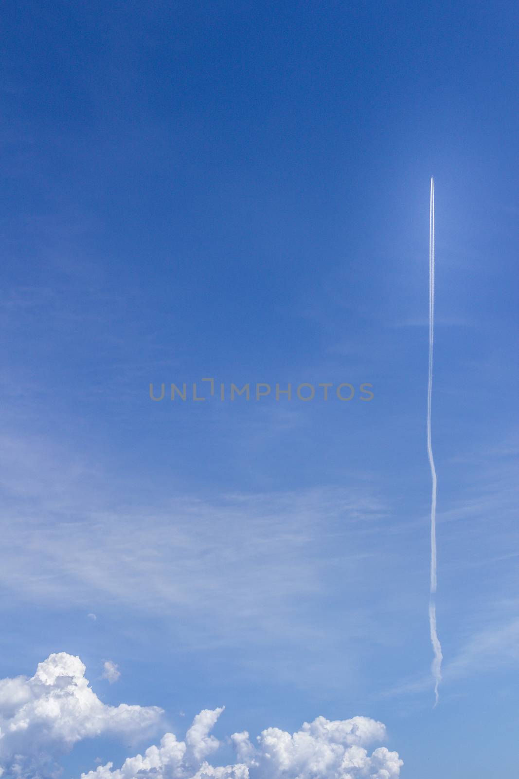 A rocket flying in the sky in the direction of space