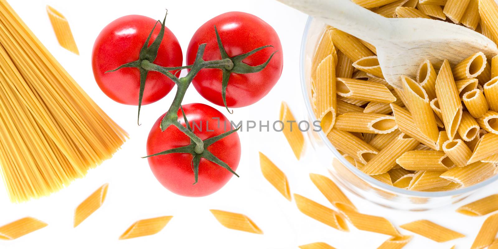 Uncooked raw italian pasta with tomatoes by germanopoli