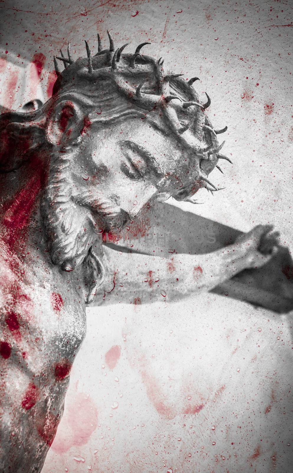 The suffering of Jesus Christ. Details of the bronze statue with blood splatters.