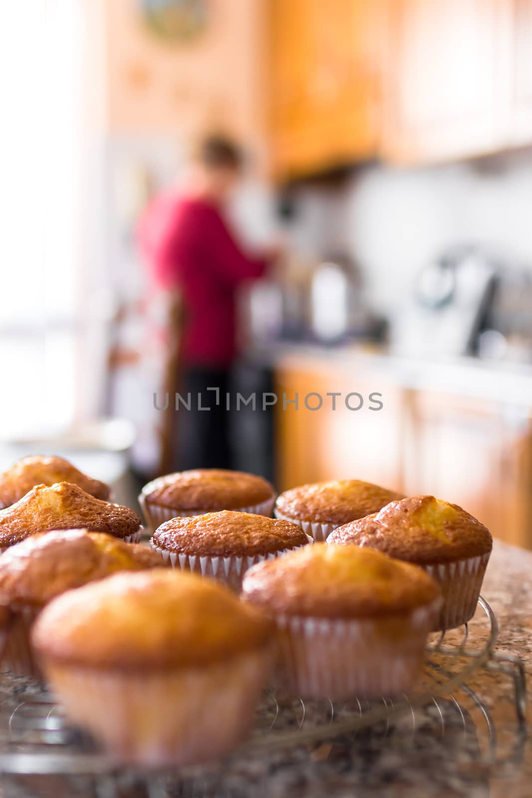 Batch of homemade freshly baked muffins by germanopoli