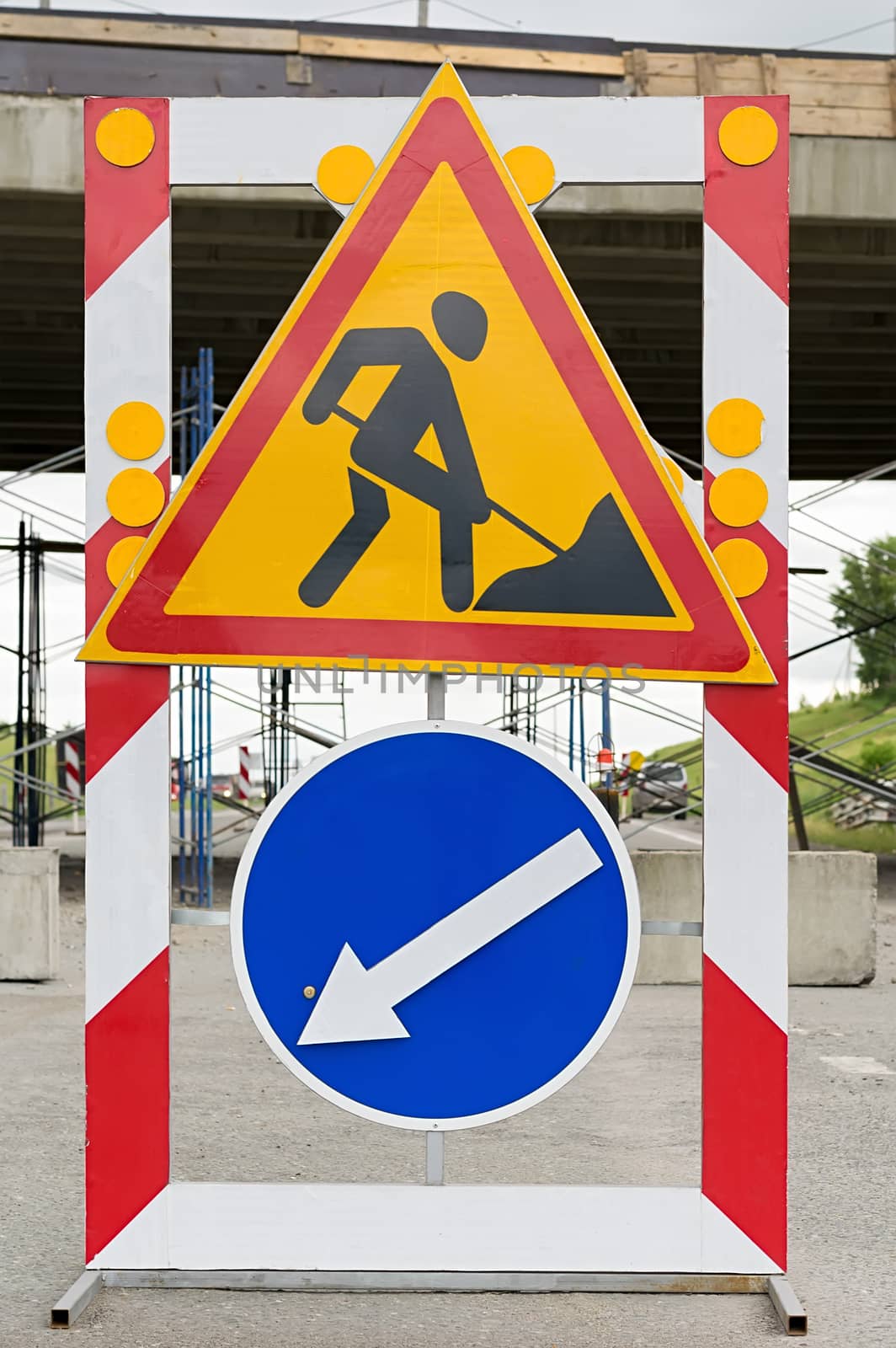 Closeup of road sign, detour, road repair on asphalt road on highway