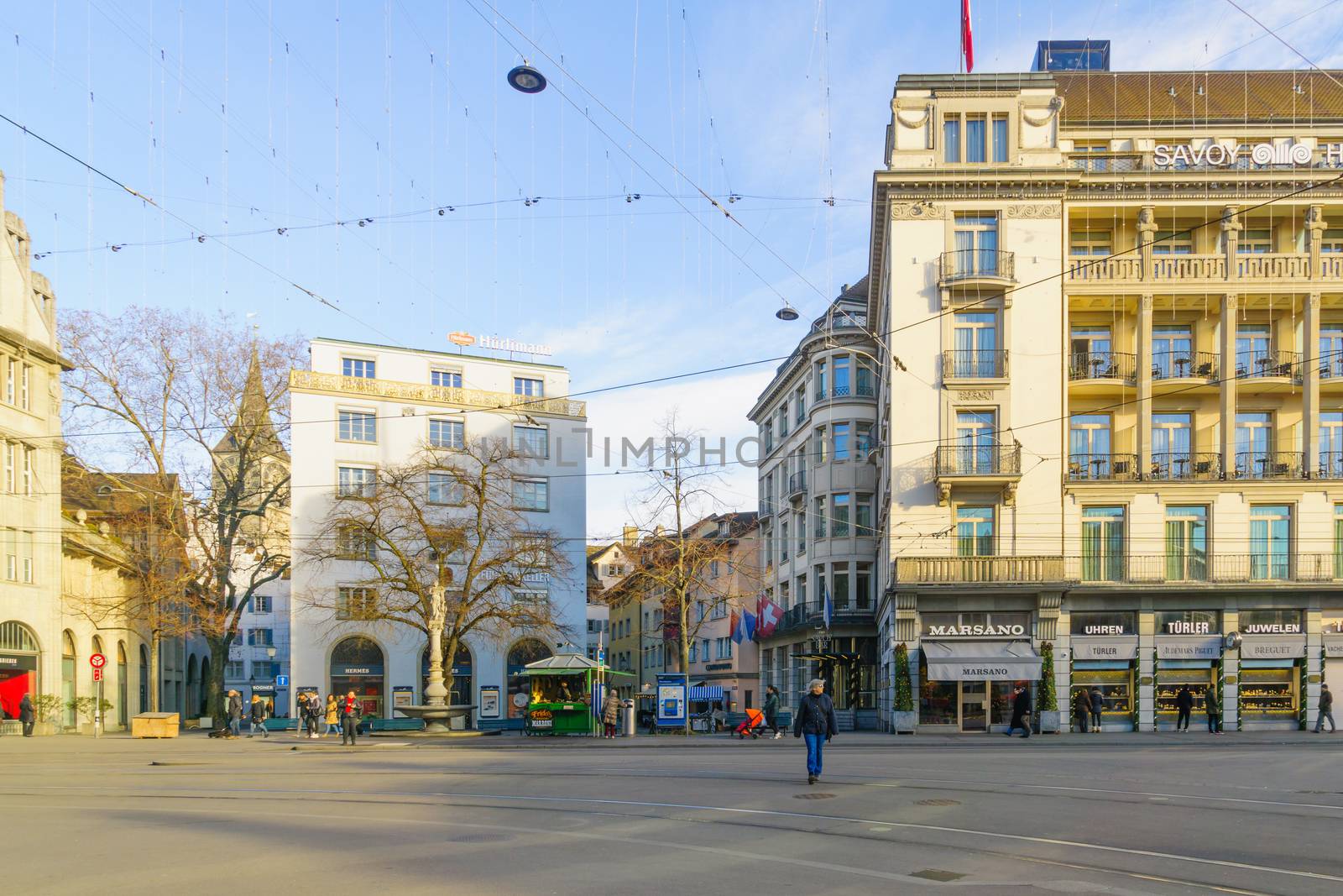 ZURICH, SWITZERLAND - DECEMBER 27, 2015: Scene of the Paradeplatz (Parade) square, with locals and visitors, in Zurich, Switzerland
