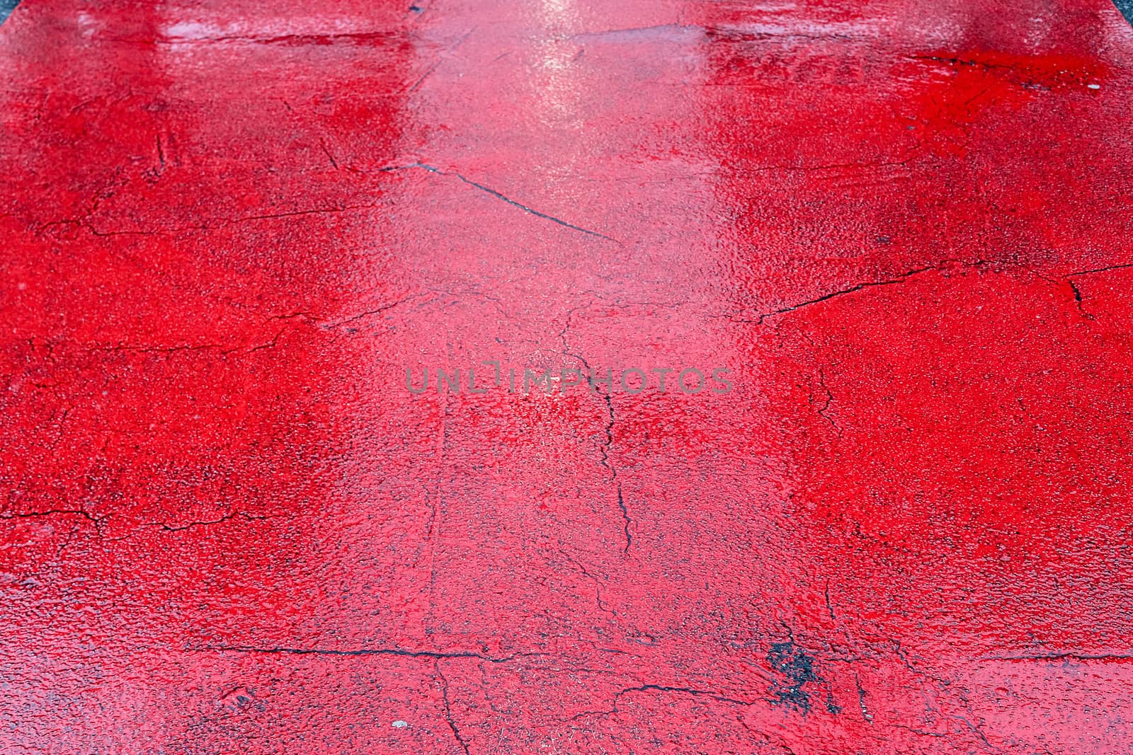 Wet ashpalt road texture. Heavy rain drops falling on city stree by MP_foto71