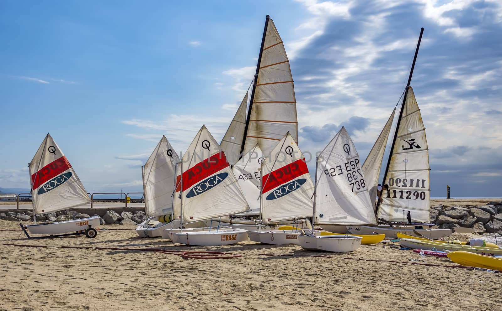 BARCELONA, SPAIN - JULY 13, 2016: People prepare yachts for surfing. Municipal Nautical Barcelona - surfing club for children and adult. Located in Park Poblenou, Barcelona, Spain.

Barcelona, Spain - July 13, 2016: People prepare yachts for surfing. Municipal Nautical Barcelona - surfing club for children and adult. Located in Park Poblenou, Barcelona, Spain.
