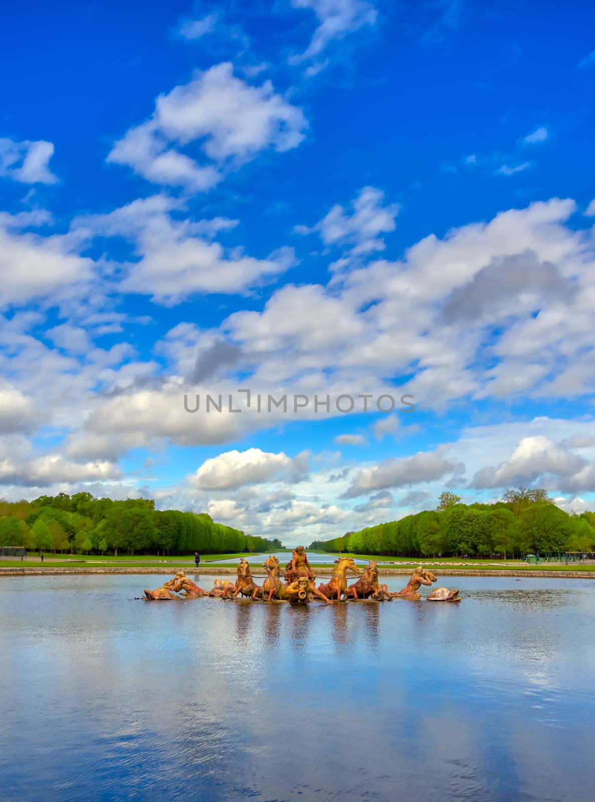 Versailles, France - April 24, 2019: Fountain of Apollo in the garden of Versailles Palace on a sunny day outside of Paris, France.