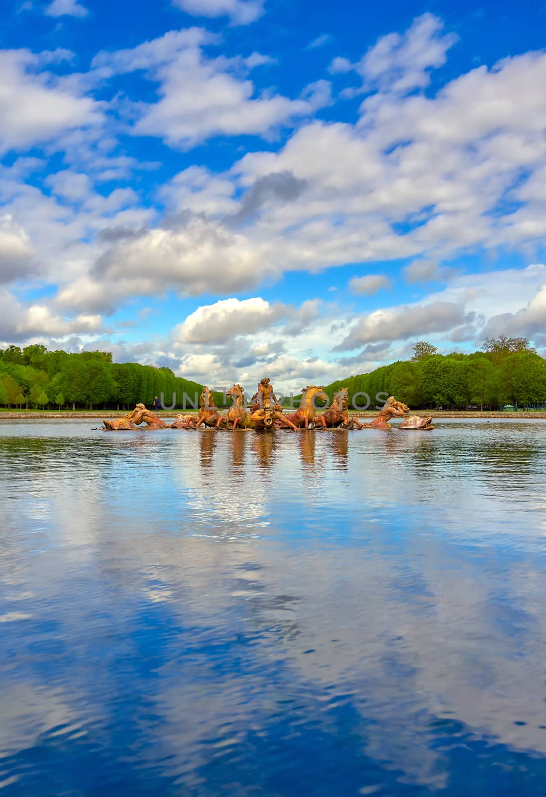 Versailles, France - April 24, 2019: Fountain of Apollo in the garden of Versailles Palace on a sunny day outside of Paris, France.