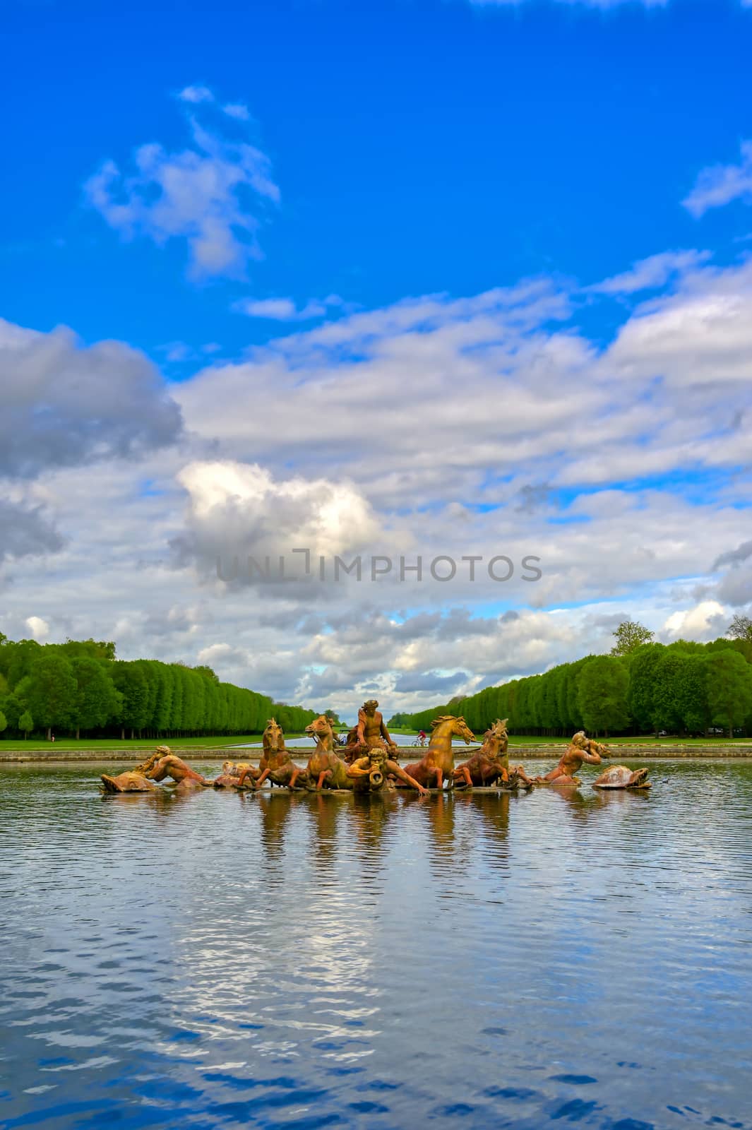 Versailles, France - April 24, 2019: Fountain of Apollo in the garden of Versailles Palace on a sunny day outside of Paris, France.