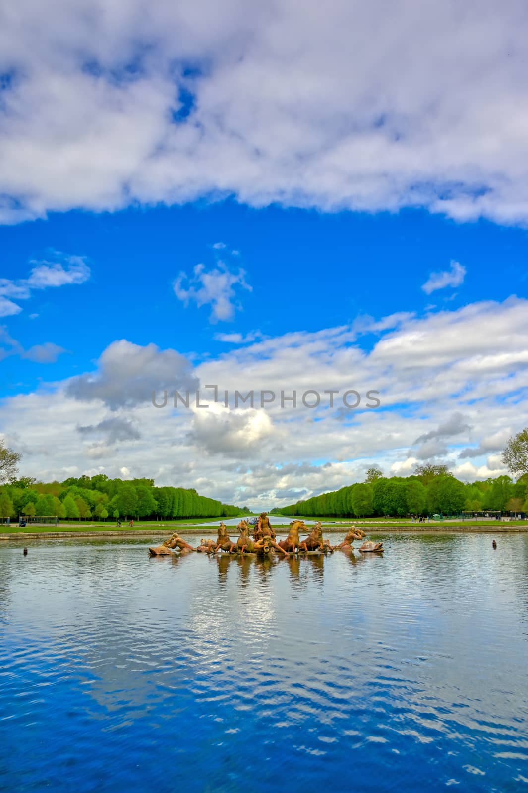 Versailles, France - April 24, 2019: Fountain of Apollo in the garden of Versailles Palace on a sunny day outside of Paris, France.