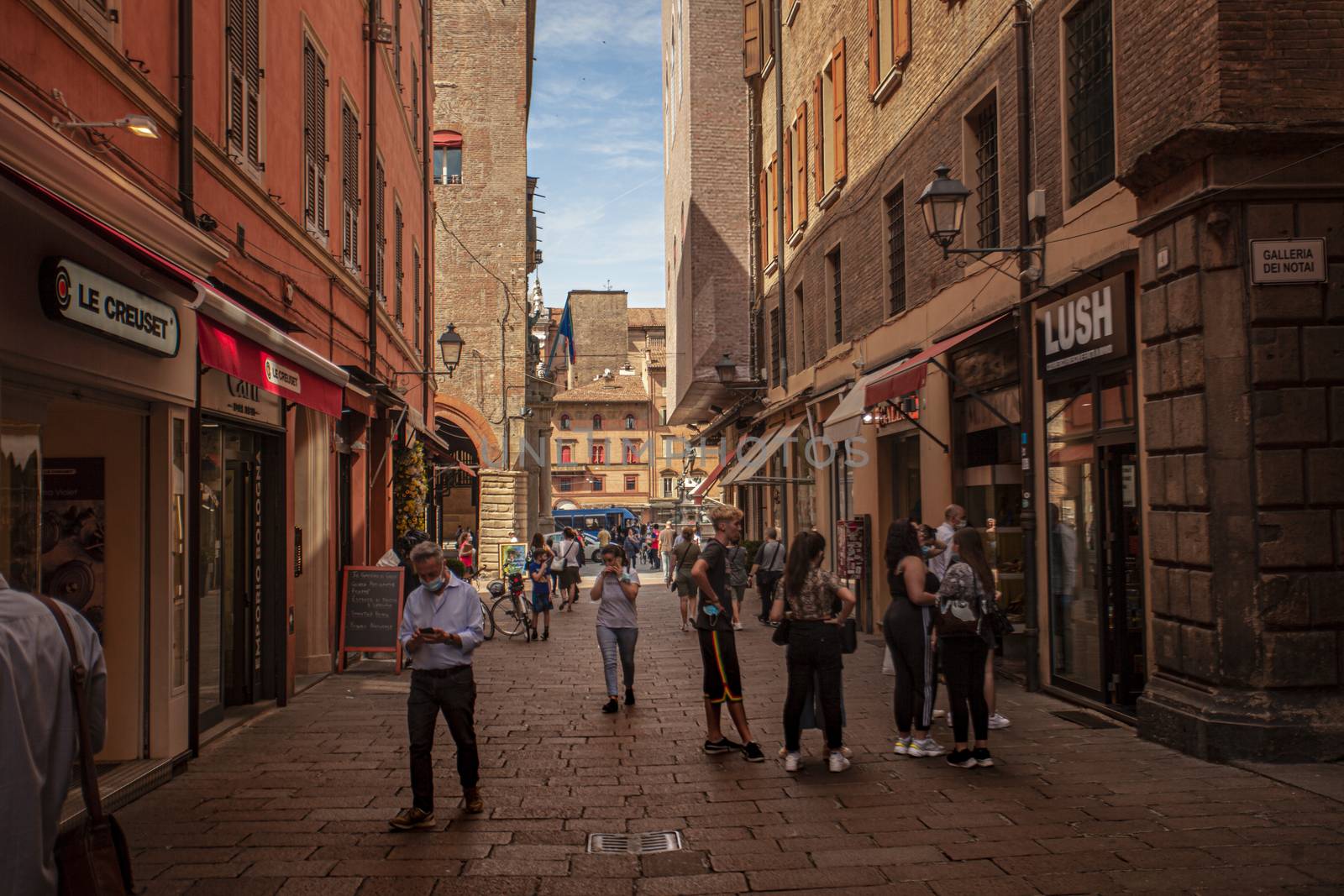 Alley of the city of Bologna in Italy with people walking 5 by pippocarlot