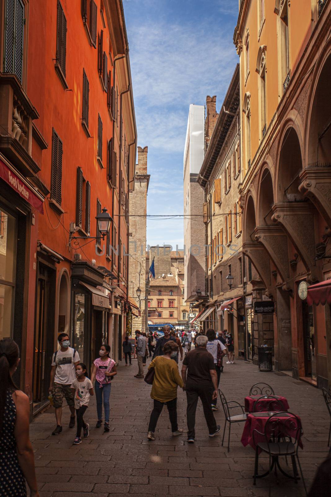 Alley of the city of Bologna in Italy with people walking 4 by pippocarlot