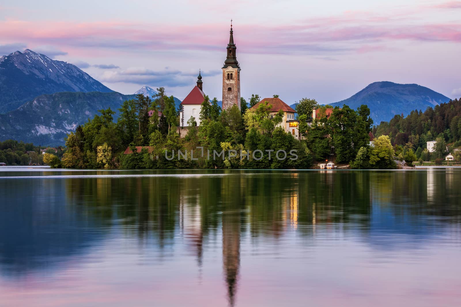 Lake Bled Slovenia. Beautiful mountain lake with small Pilgrimage Church. Most famous Slovenian lake and island Bled with Pilgrimage Church of the Assumption of Maria. Bled, Slovenia, Europe. 
