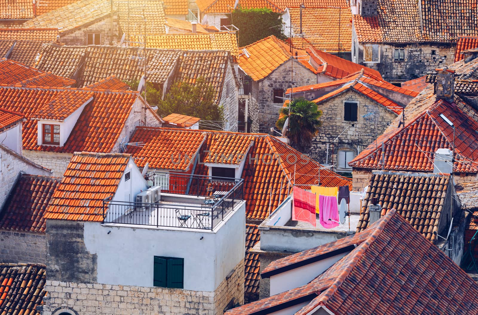 Trogir in Croatia, town panoramic view with red roof tiles, Croatian tourist destination. Trogir town sea front view, Croatia. Roofs of Trogir in Croatia.