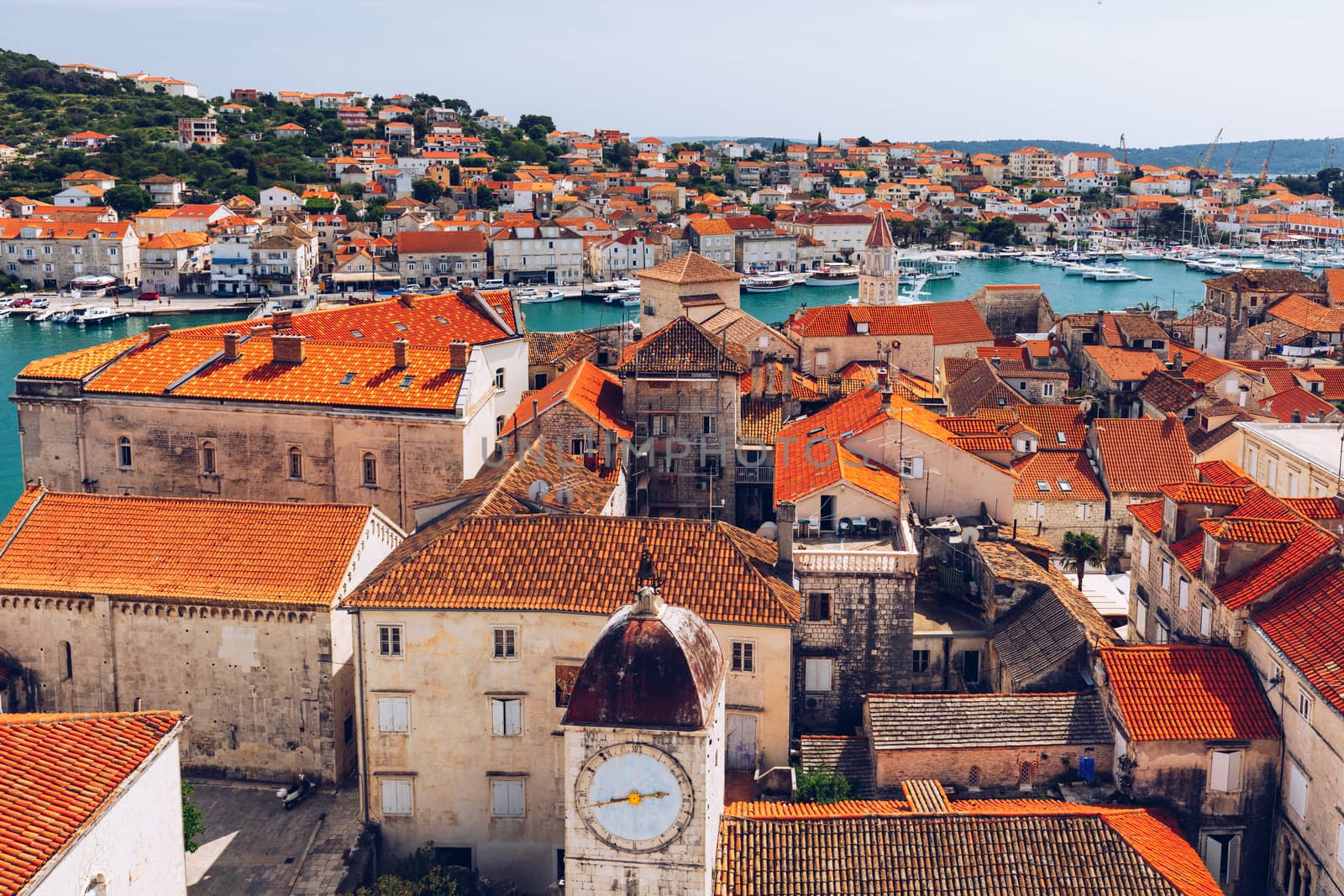 Trogir in Croatia, town panoramic view with red roof tiles, Croatian tourist destination. Trogir town sea front view, Croatia. Roofs of Trogir in Croatia.
