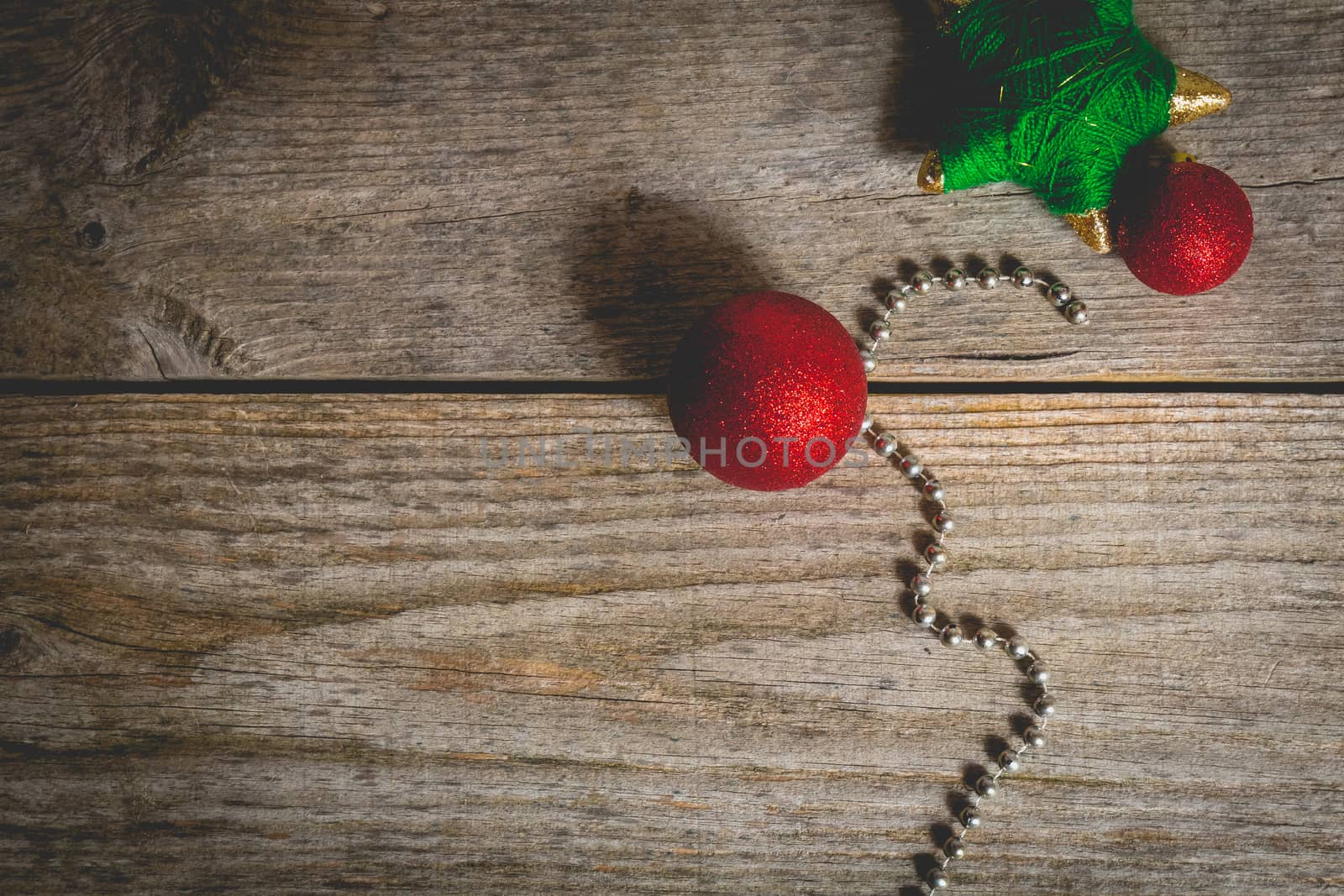 merry christmas concept with red decoration on old wooden board