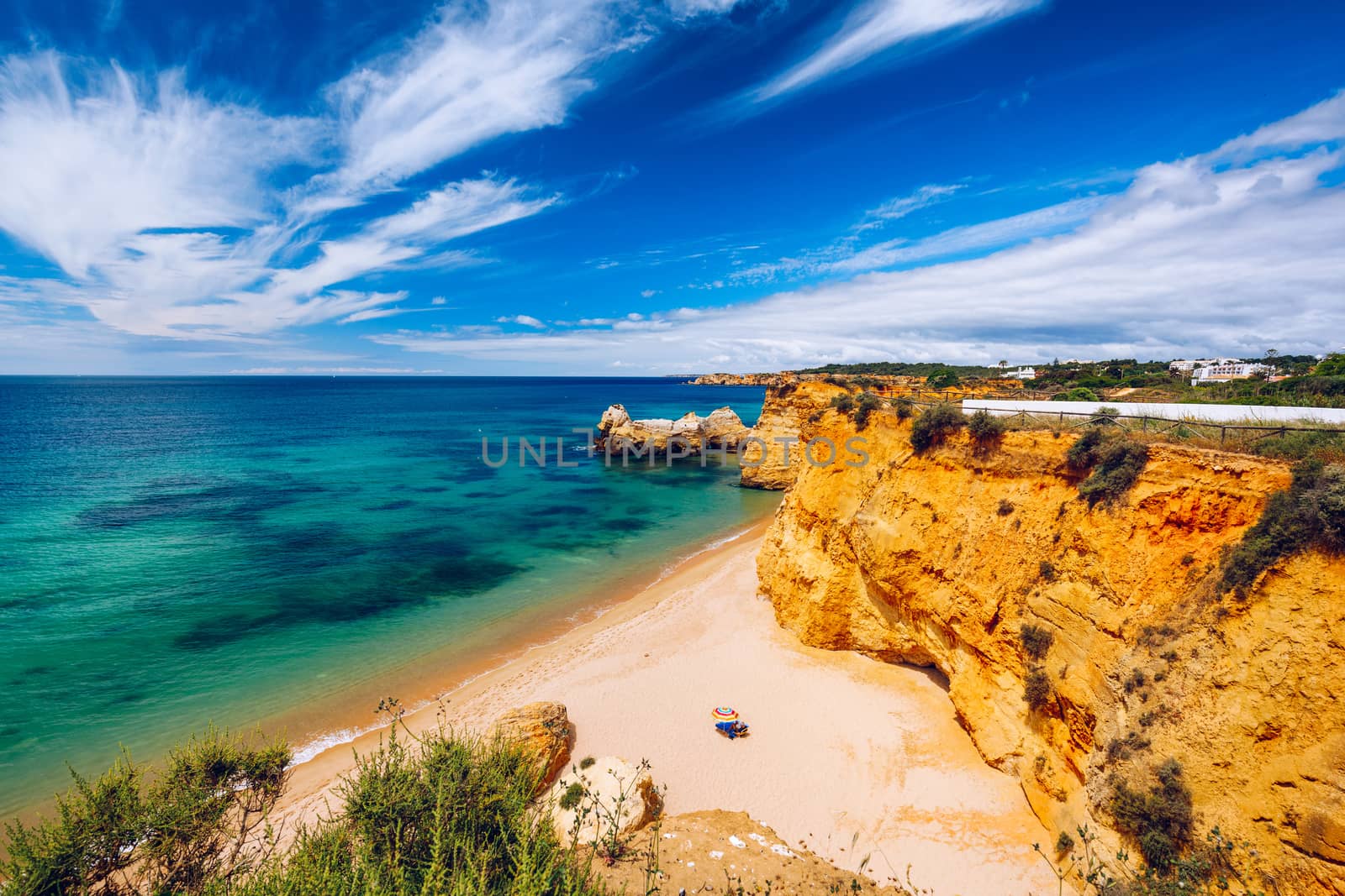 Praia dos Tres Castelos in south Portugal, Portimao, Algarve region. Landscape with Atlantic Ocean, shore and rocks in Tres Castelos beach (Praia dos Tres Castelos), Algarve, Portimao, Portugal.