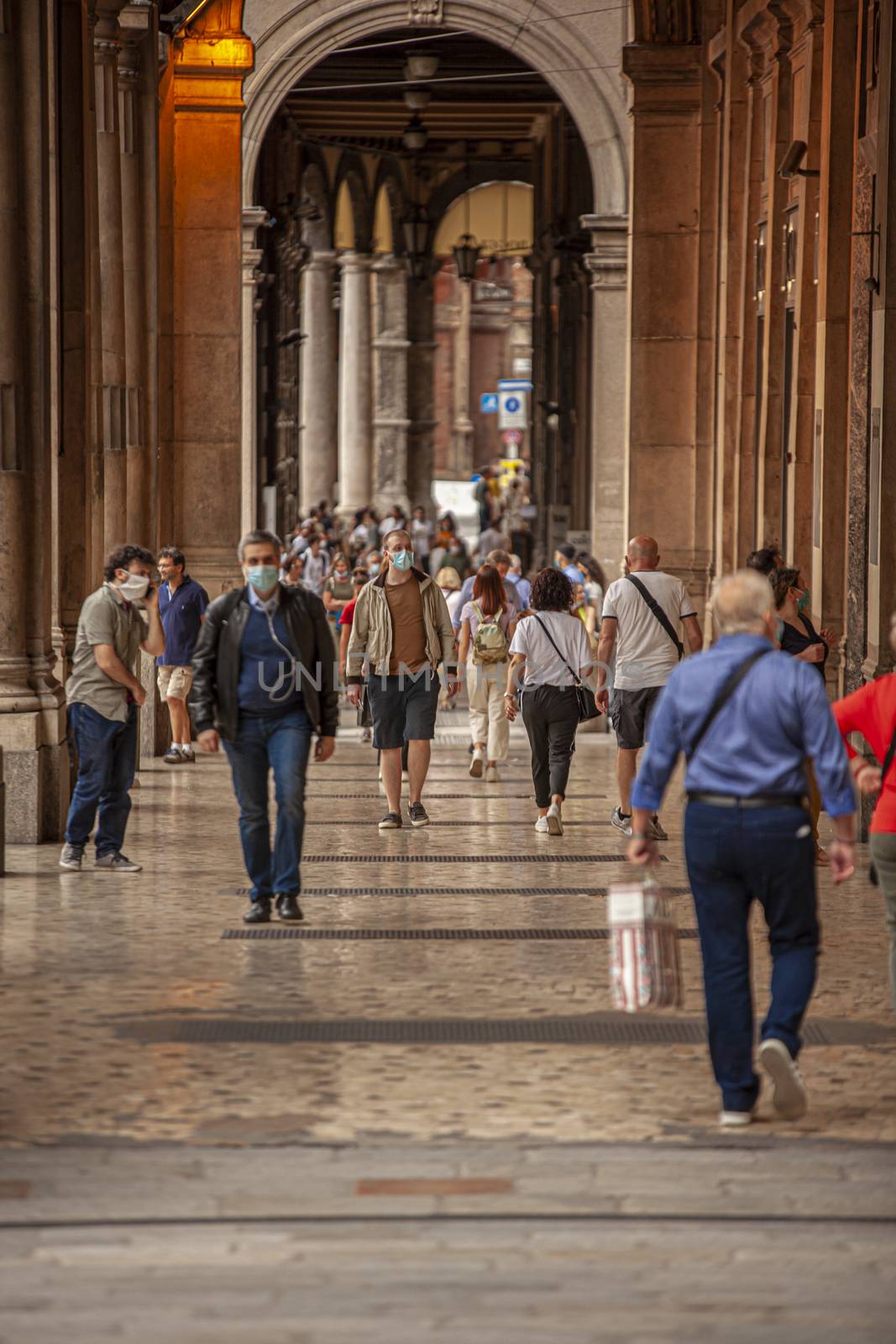 People walking under arcades in Bologna, Italy 7 by pippocarlot