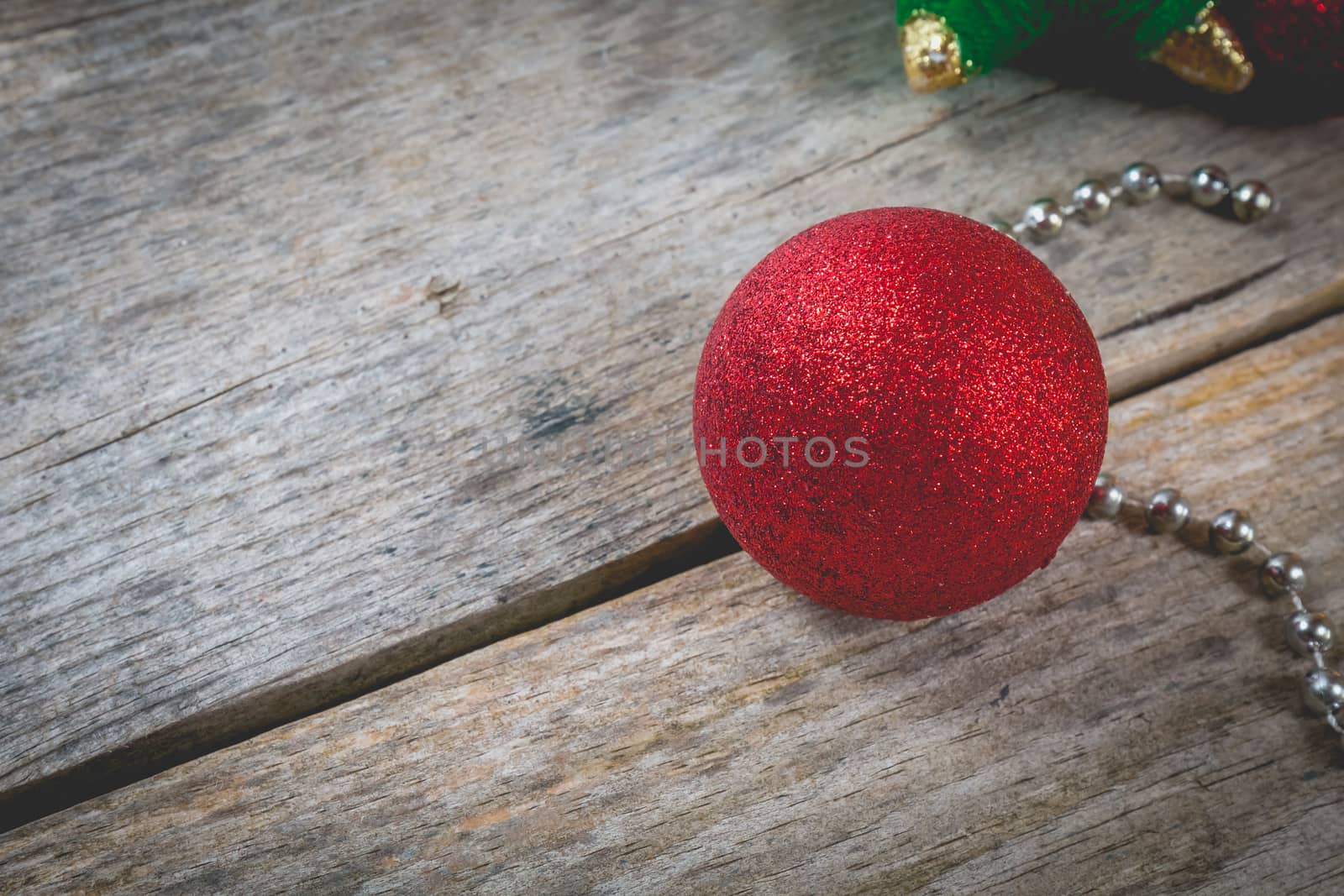 merry christmas concept with red decoration on old wooden board