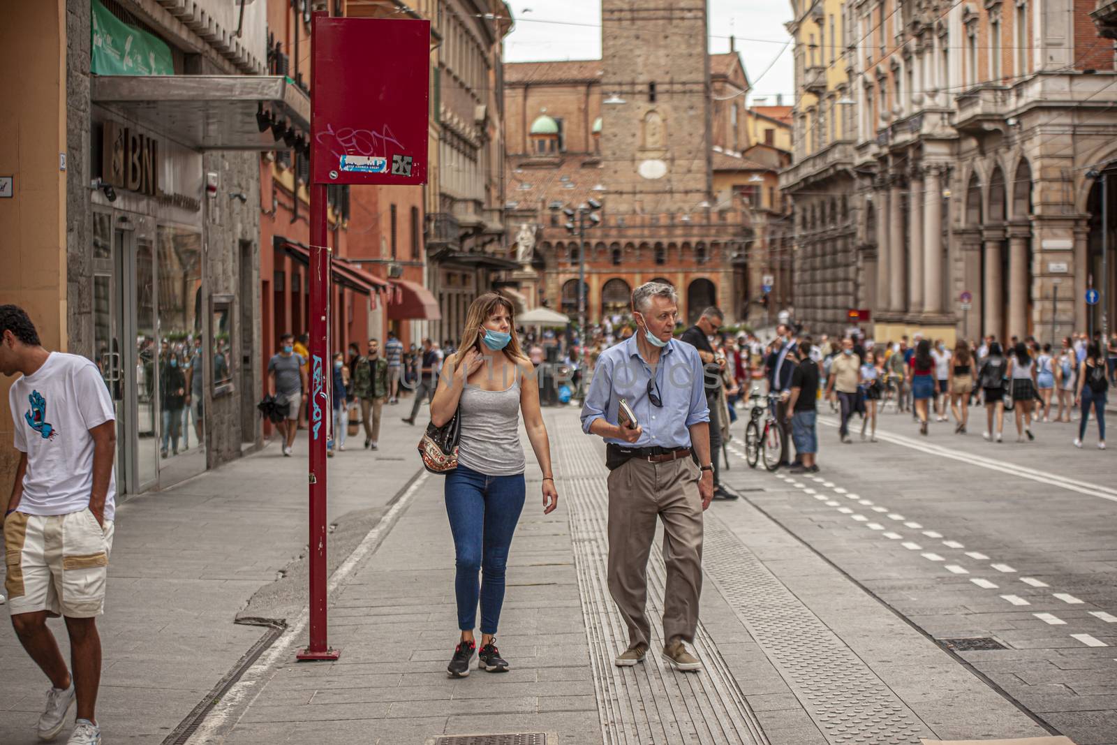 BOLOGNA, ITALY 17 JUNE 2020: People in Bologna walking on city center