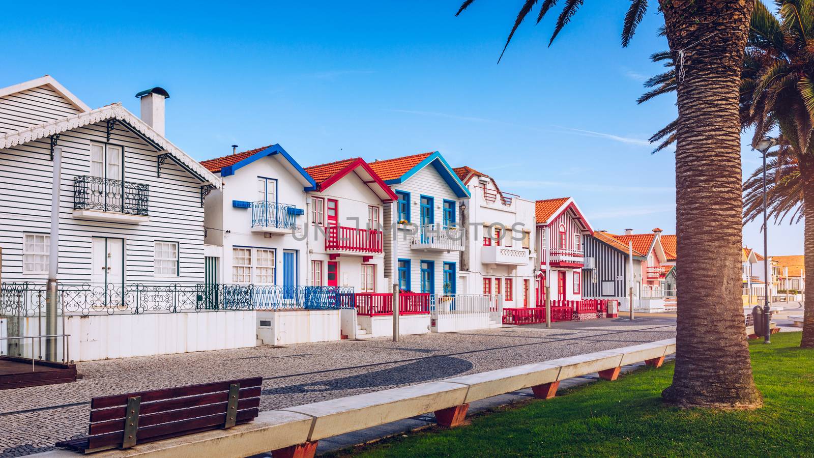 Street with colorful houses in Costa Nova, Aveiro, Portugal. Street with striped houses, Costa Nova, Aveiro, Portugal. Facades of colorful houses in Costa Nova, Aveiro, Portugal.