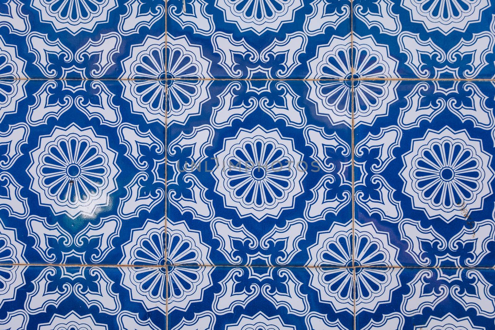Azulejo is a form of Portuguese or Spanish painted, tin-glazed, ceramic tile work. Azulejos is traditional Portugese tiles in Aveiro. Architecture ornament. Aveiro, Portugal.