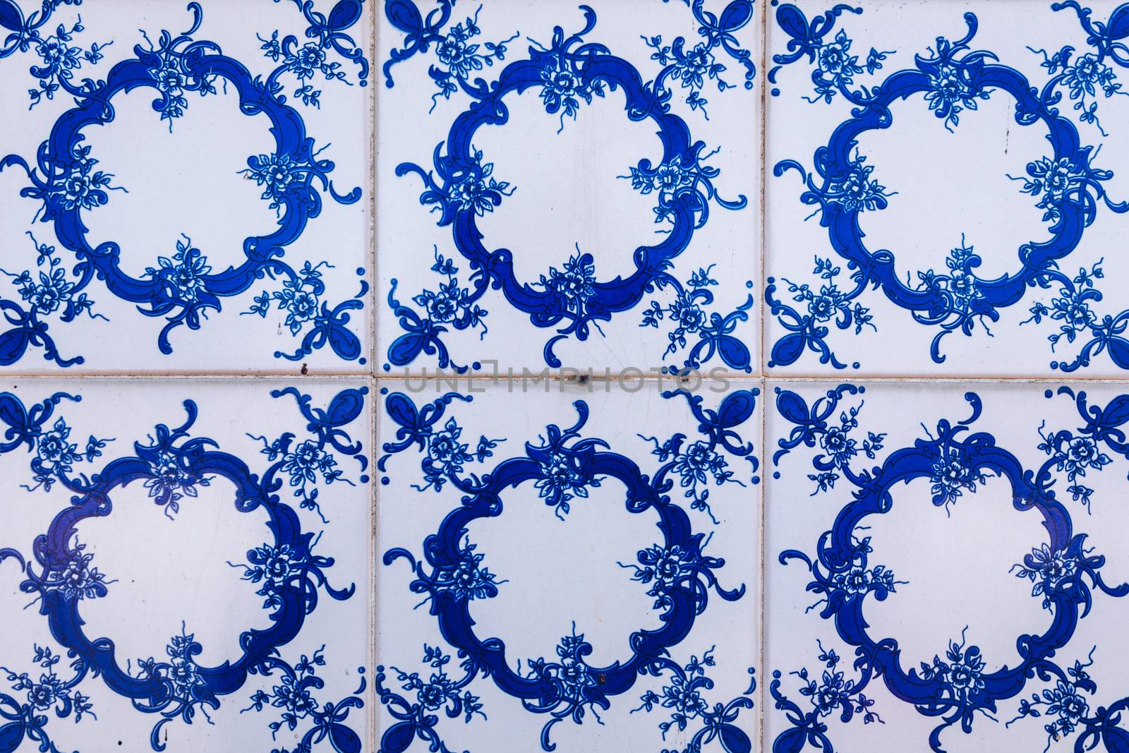 Azulejo is a form of Portuguese or Spanish painted, tin-glazed, ceramic tile work. Azulejos is traditional Portugese tiles in Aveiro. Architecture ornament. Aveiro, Portugal.
