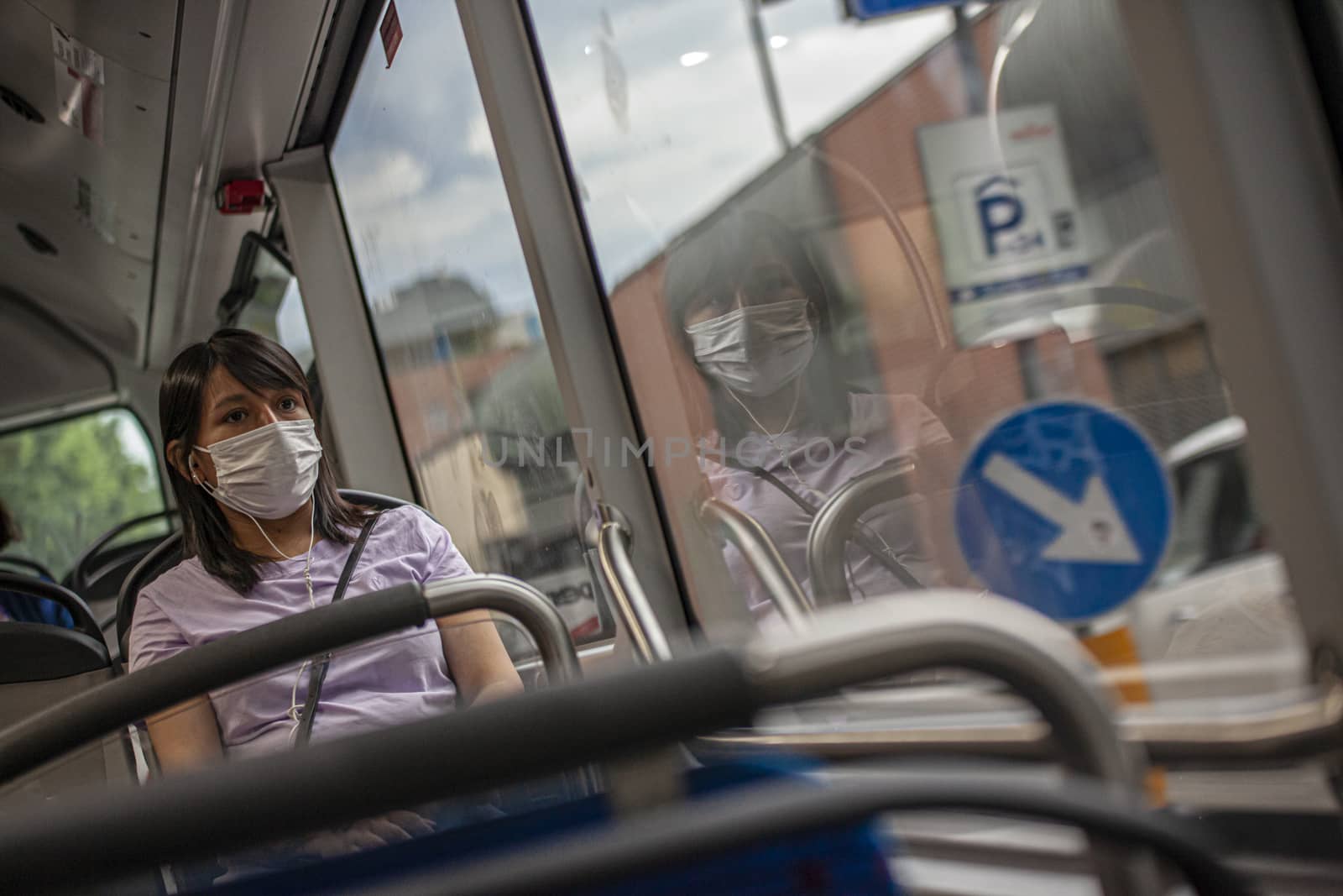 Girl in the bus with medical mask during Covid quarantine 2 by pippocarlot