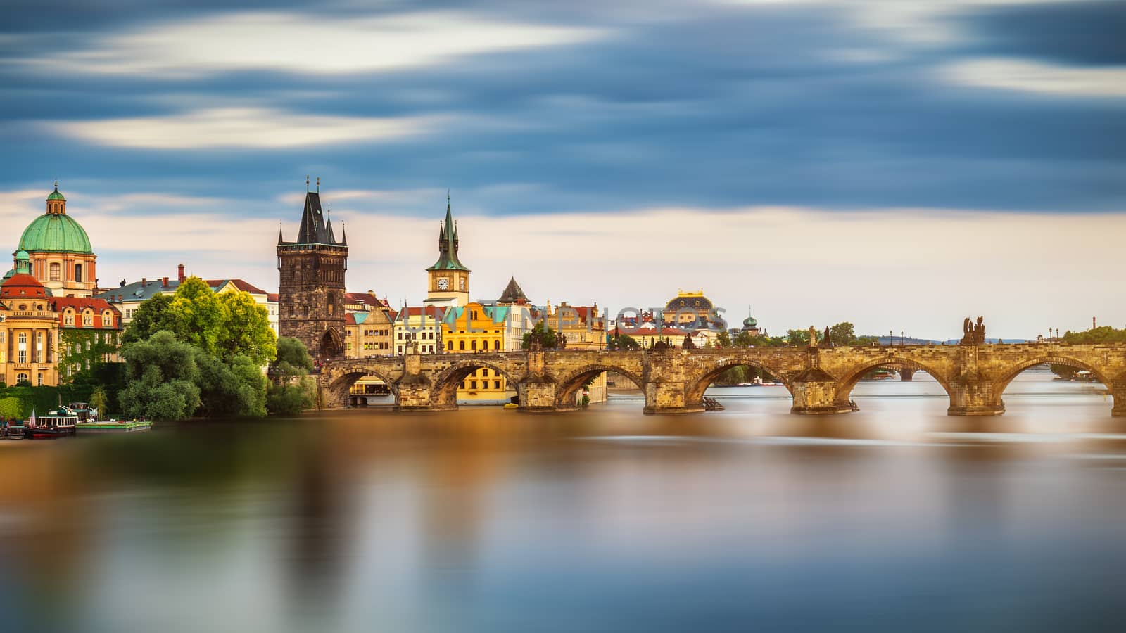 View of the Vltava River and the bridges shined with the sunset sun, Prague, the Czech Republic