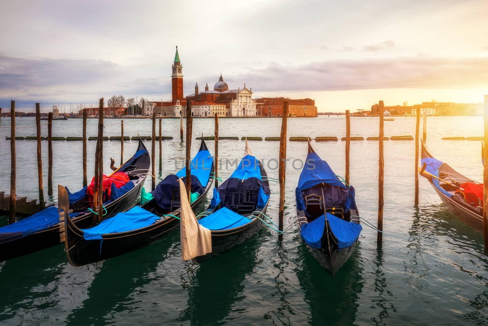 Canal with gondolas in Venice, Italy. Architecture and landmarks of Venice. Venice postcard with Venice gondolas.