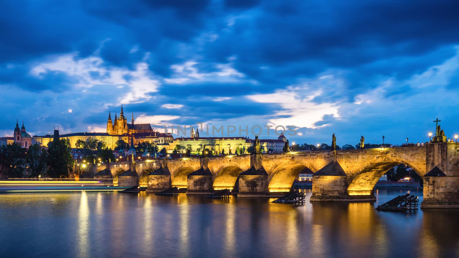 Famous iconic image of Prague castle and Charles Bridge, Prague, Czech Republic. Concept of world travel, sightseeing and tourism.