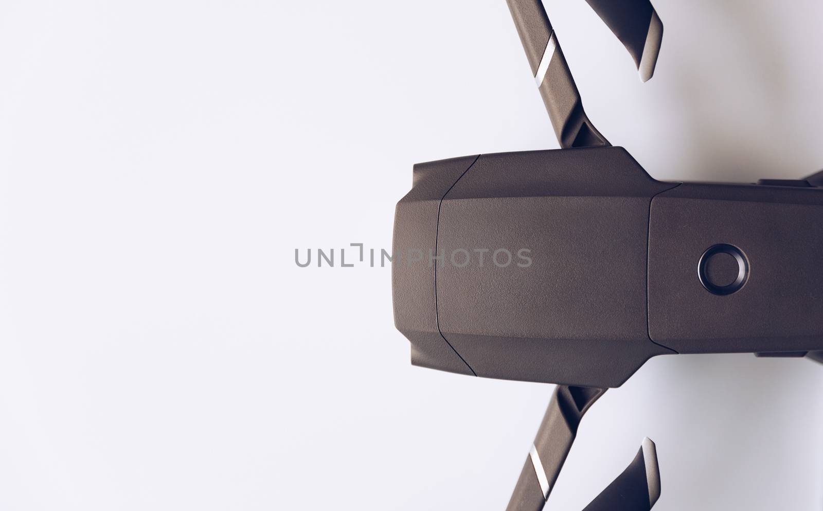 New modern drone on display on white background. Drone quadcopter with digital camera.