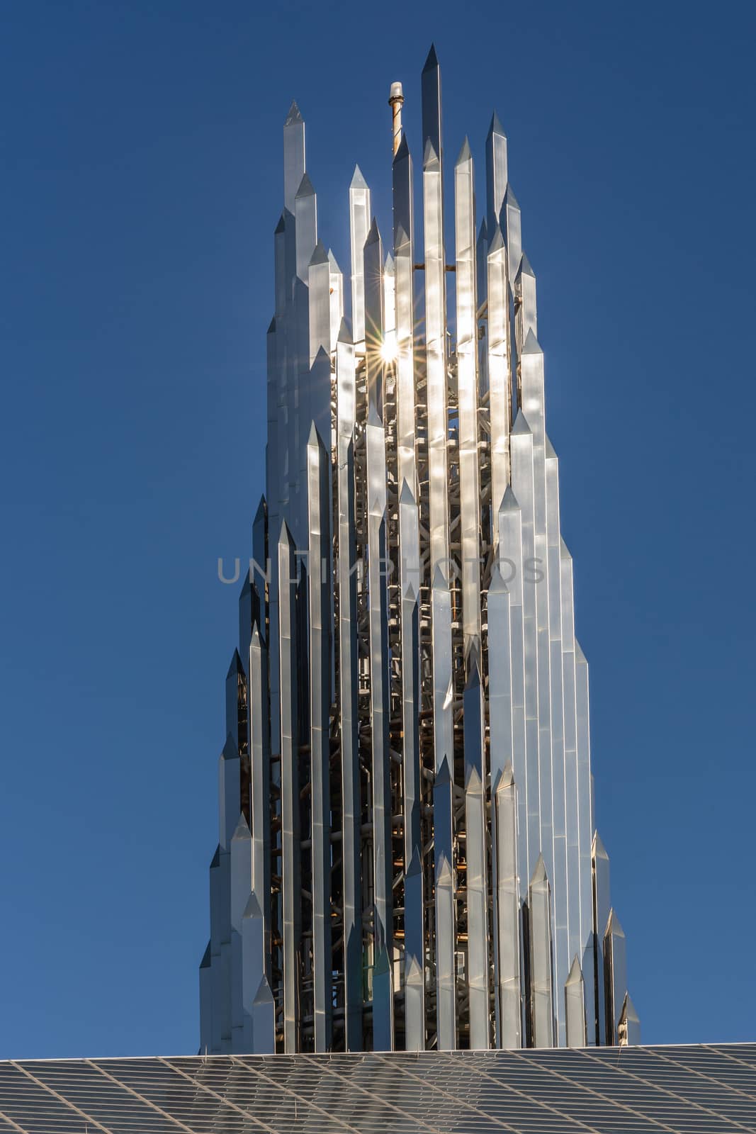 Garden Grove, California, USA - December 13, 2018: Crystal Christ Cathedral. Closeup of Crean Tower against blue sky.