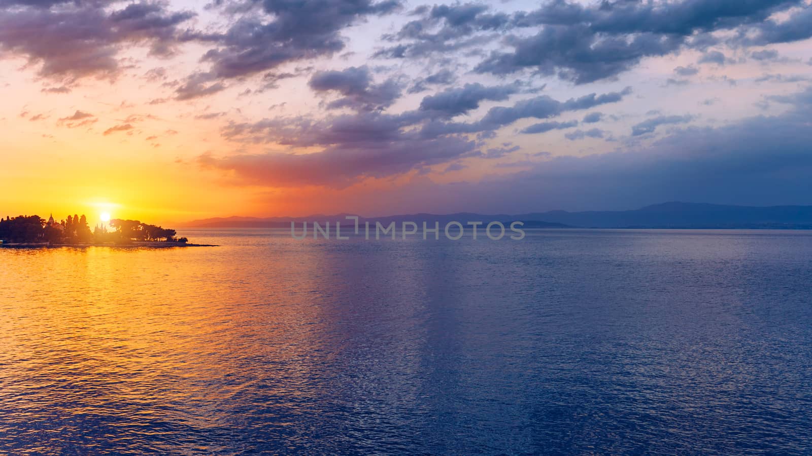 Beautiful sunset or sunrise above the sea. Tropical sunset or sunrise over sea. Colourful sunset or sunrise over water.