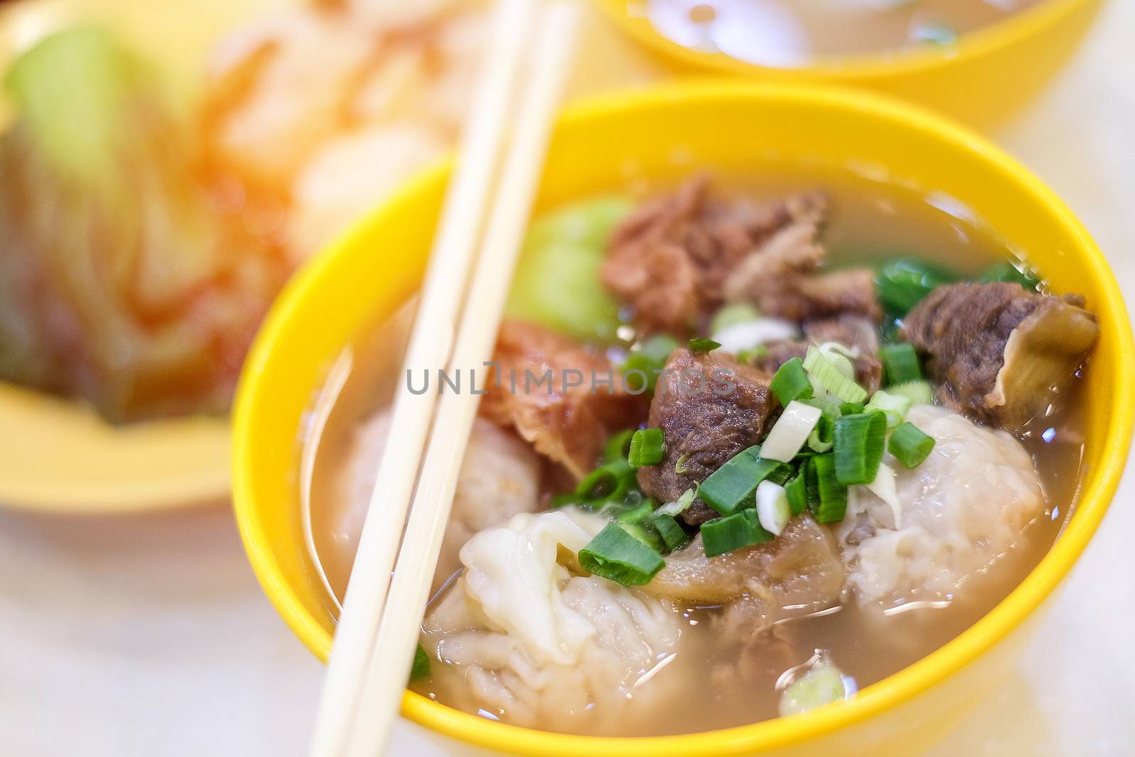 Pork soup and dumpling close up in Hong Kong by Surasak